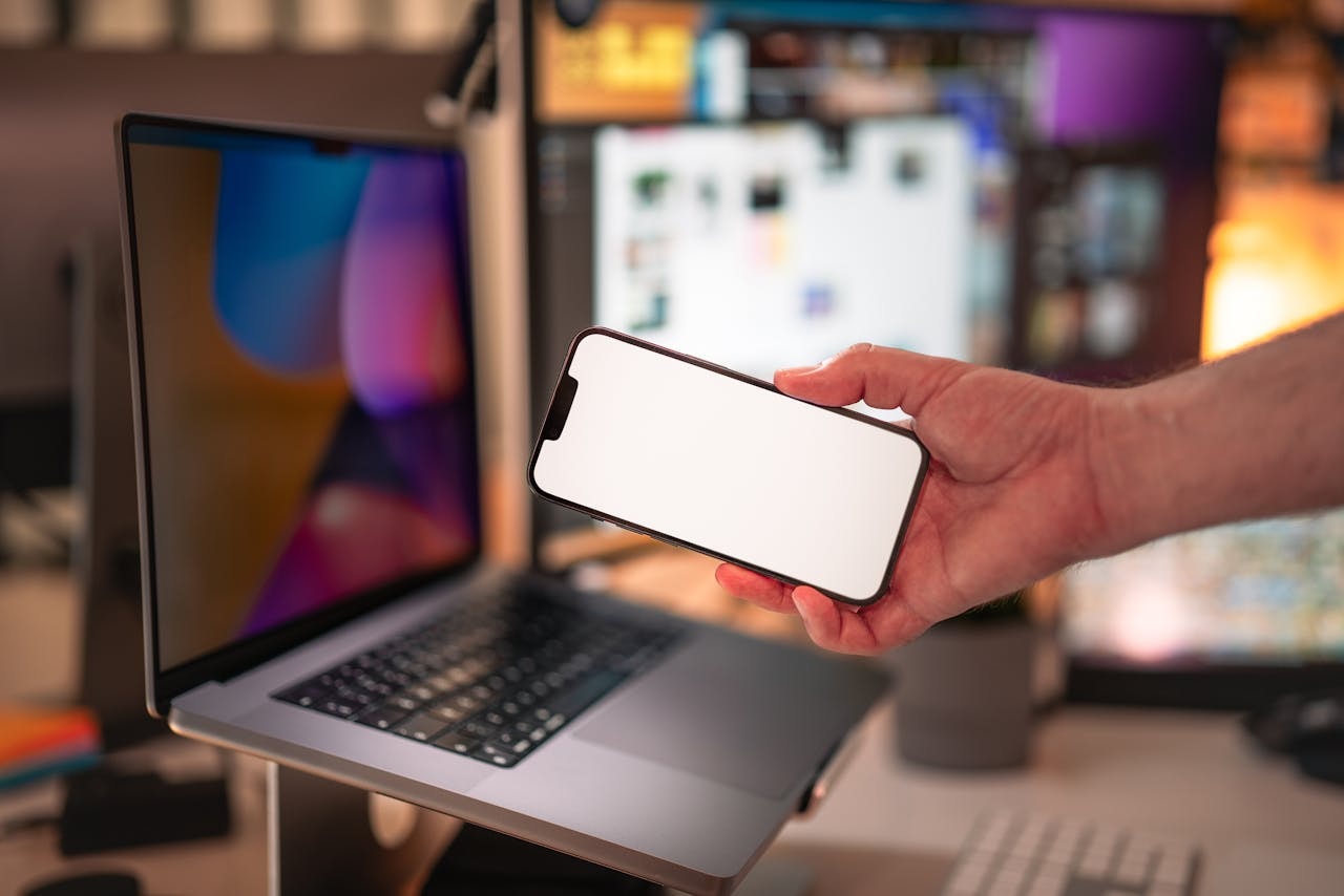 man-holding-smartphone-in-modern-office-setting