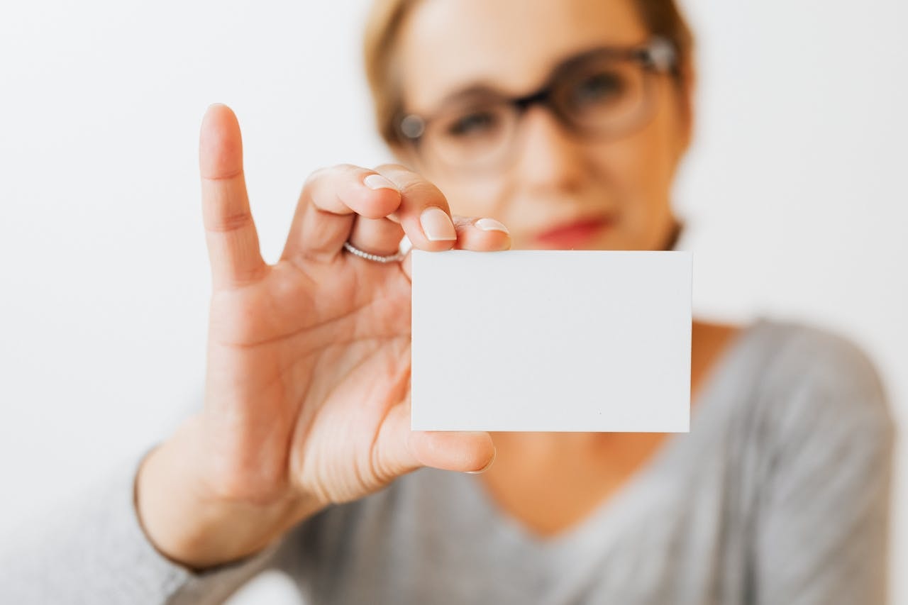 a-woman-holding-a-blank-card