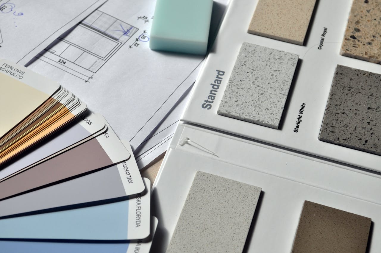 gray-standard-color-book-near-green-eraser